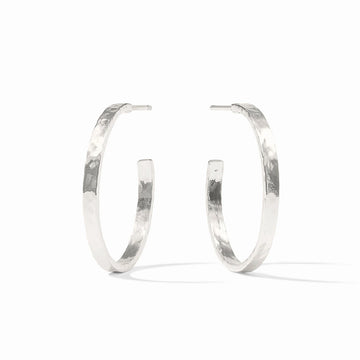 A pair of textured silver hoop earrings with a hammered finish, displayed on a clean white background.