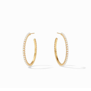 Gold hoop earrings adorned with delicate white pearls.
