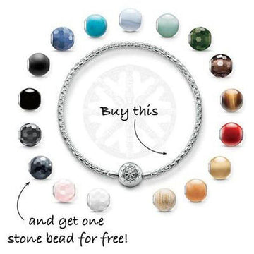 Silver bracelet with nautical charm, surrounded by colorful gemstone beads; buy one, get one free.
