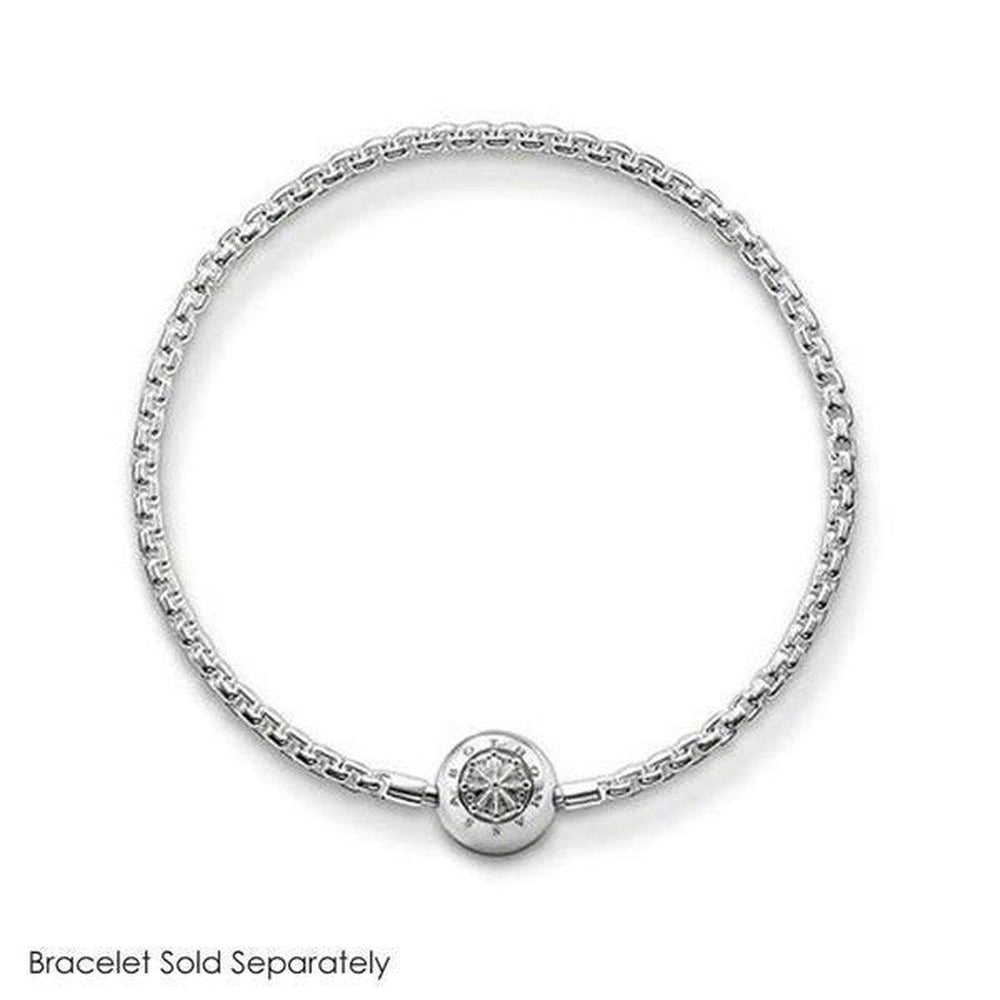 Silver charm featuring an ornate, circular design, shown on a silver chain bracelet (bracelet sold separately).
