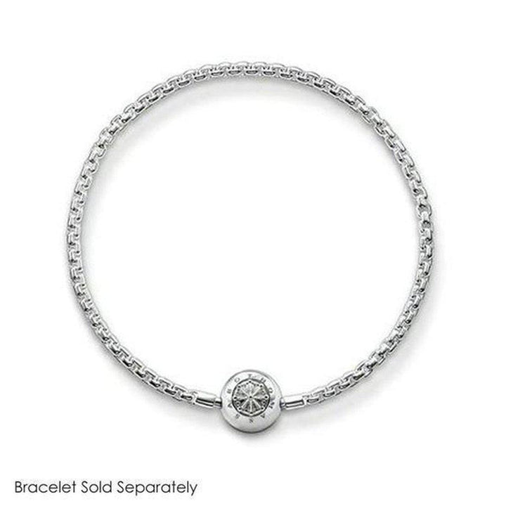 Silver charm featuring an ornate, circular design, shown on a silver chain bracelet (bracelet sold separately).
