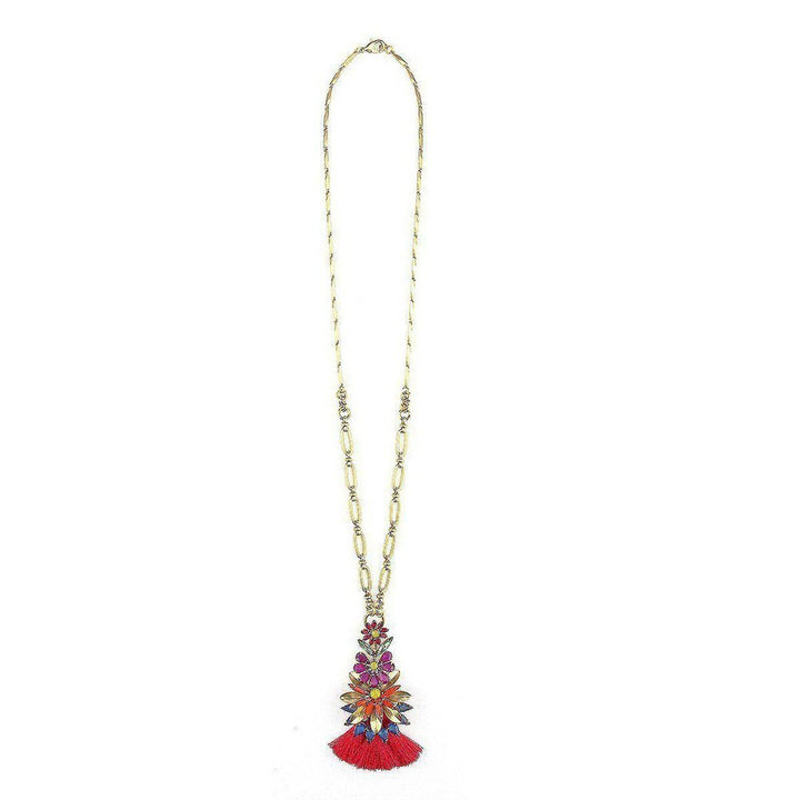 Gold chain necklace with colorful floral pendant and red tassel.
