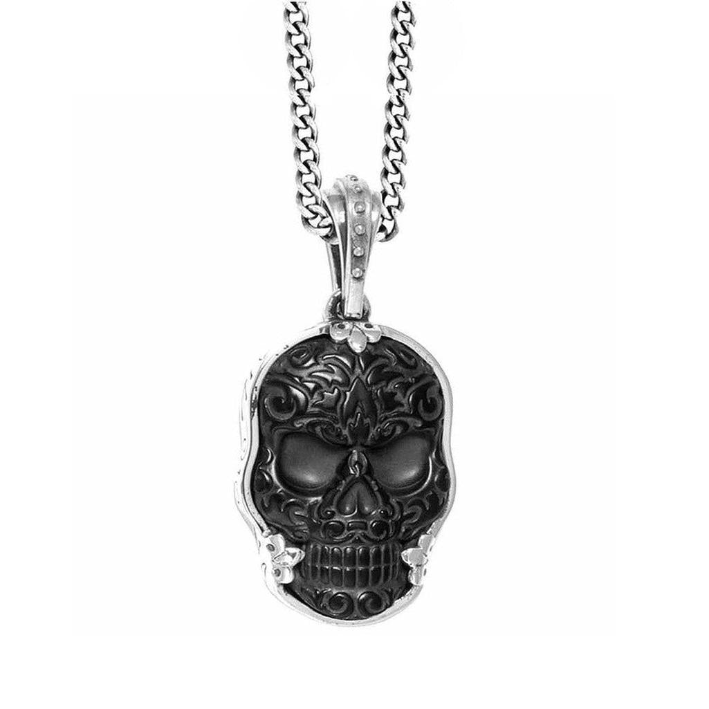 Large Carved Jet Baroque Skull Pendant necklace, black stone skull with ornate silver chain.
