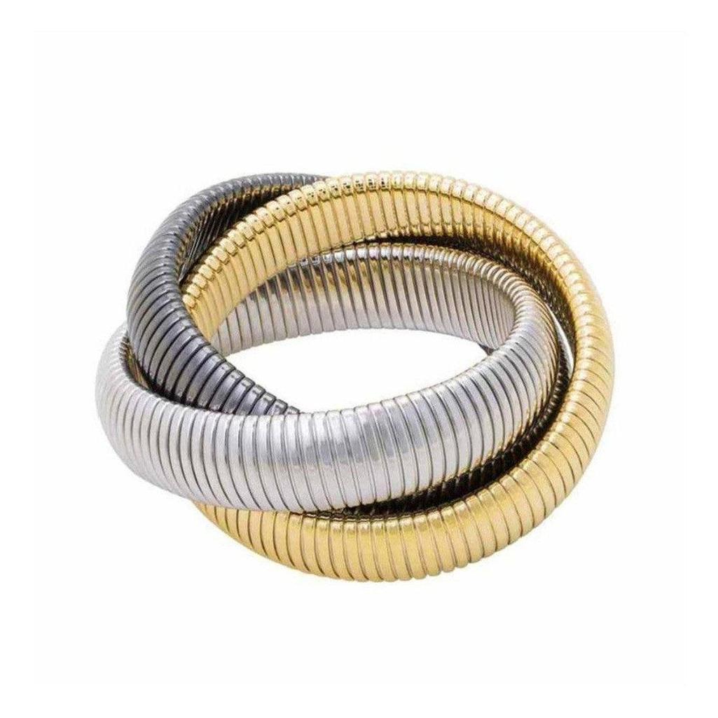Triple twist cobra bracelet in gold, rhodium, and gunmetal.

