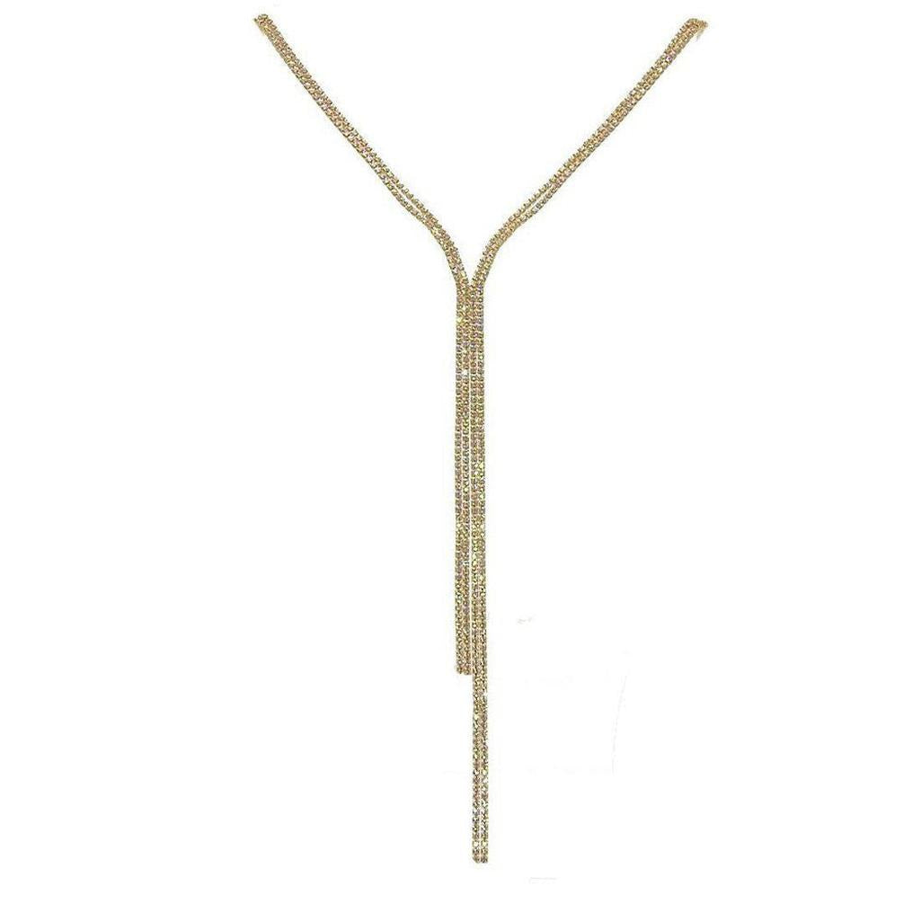 Gold lariat necklace with crystal accents, dangling design.
