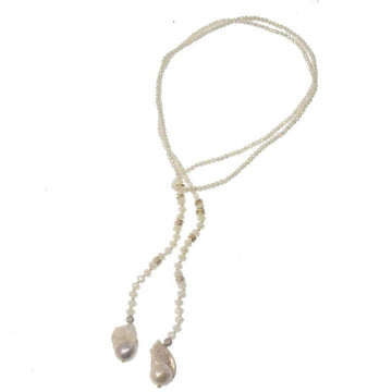 Elegant lariat necklace featuring baroque pearls and crystal beads; perfect for adding a touch of sophistication to any outfit.
