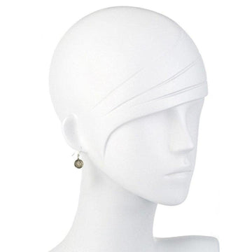 Small, round silver earrings on a mannequin, featuring a subtle design.
