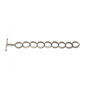 Silver link bracelet with hammered texture, T-bar clasp.
