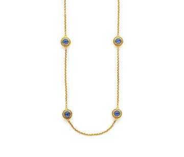 Loire Station Necklace: Gold chain with three blue sapphires.
