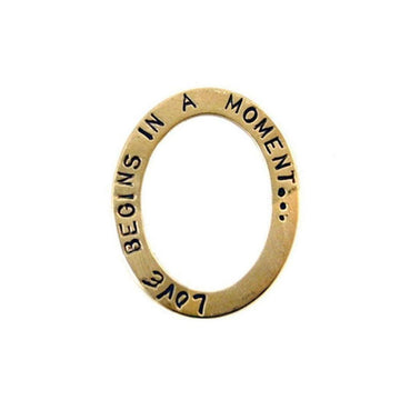 Gold "Love Begins In A Moment" pendant charm
