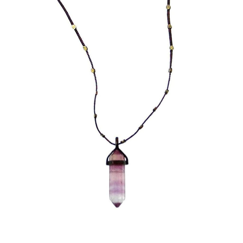 Love Heals Nico Fluorite Pendant: Purple, layered fluorite point on a dark cord necklace with gold accents.
