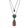 Lucid Tassel Necklace: Double-strand necklace with green stone, gold tassel, and black accents.
