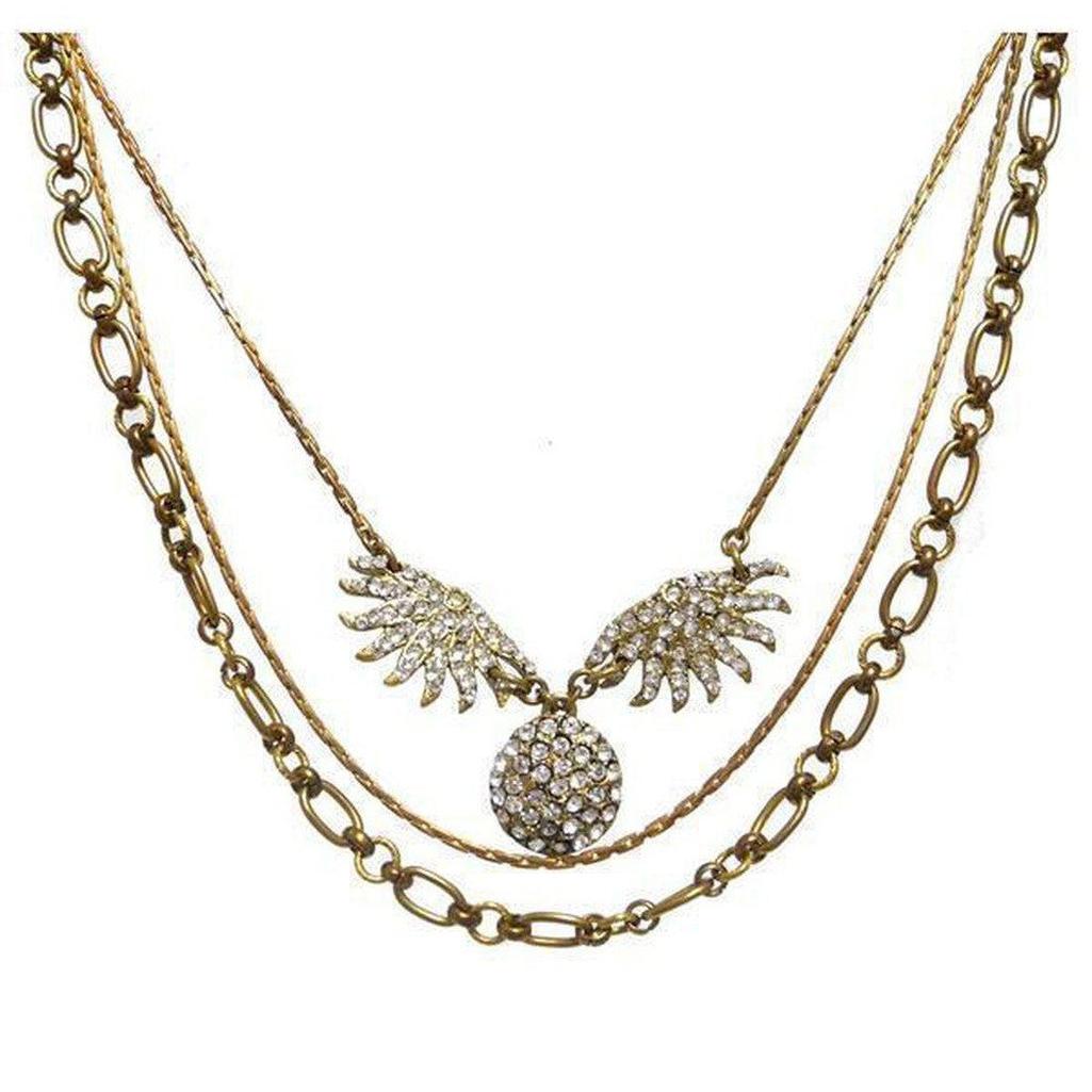 Lulu Frost Heirloom Sunburst necklace: antique gold layered chain with sparkling crystal sunburst pendant.
