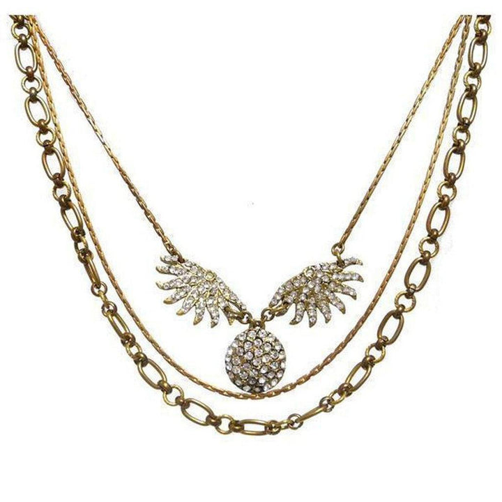 Lulu Frost Heirloom Sunburst necklace: antique gold layered chain with sparkling crystal sunburst pendant.
