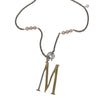 Lulu Frost Plaza Letter M Necklace: gold initial M pendant with bronze chain and blush pearls.
