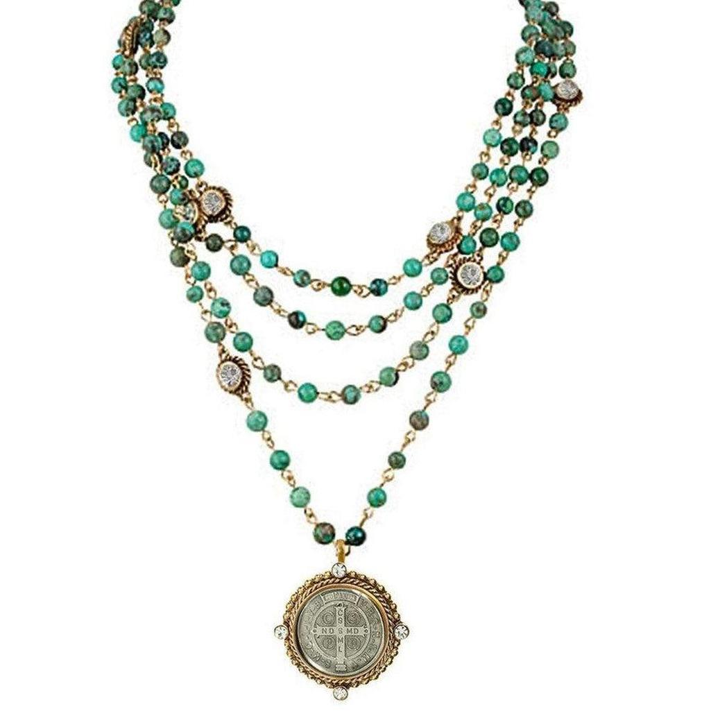 Lux 4mm Turquoise Magdalena necklace: 4-strand turquoise bead & gold chain with medallion pendant.
