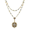 Lux Mixed Pearl Rosary necklace: Two-strand design with gold, pearl, and grey beads, featuring a detailed antique-style pendant.

