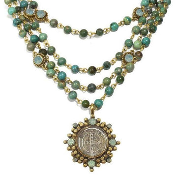 Layered turquoise bead necklace with antique-style pendant
