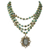 Lux Turquoise Magdalena Asst Medals necklace: Three-strand turquoise & gold beaded necklace with a detailed antique-style pendant.
