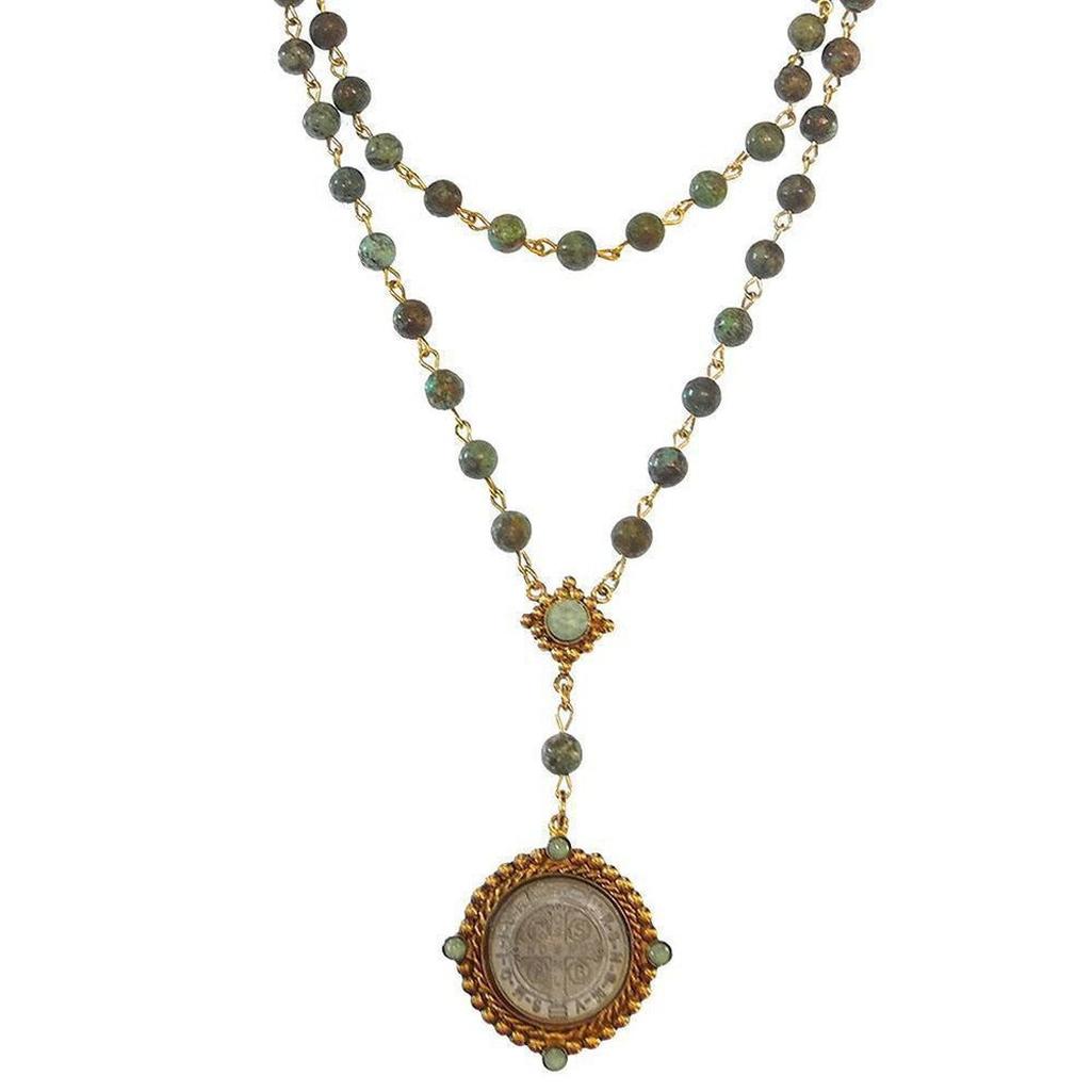 Lux Turquoise Rosary: Double-strand necklace with green turquoise beads and gold accents, featuring a St. Christopher medal.
