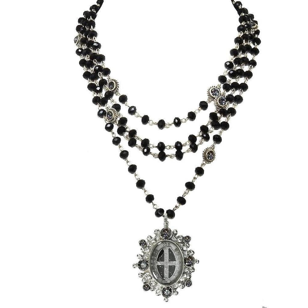 Magdalena 6mm Jet necklace: layered black beads, silver chain, & ornate pendant.
