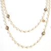 Elegant Magdalena Wrap necklace: double-strand faux pearl & gold chain with crystal accents.
