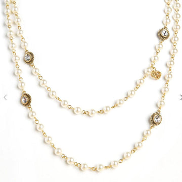 Elegant Magdalena Wrap necklace: double-strand faux pearl & gold chain with crystal accents.
