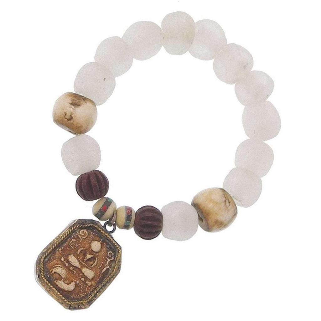 Meditating Buddha bracelet with white and brown beads, featuring a bronze Om charm.
