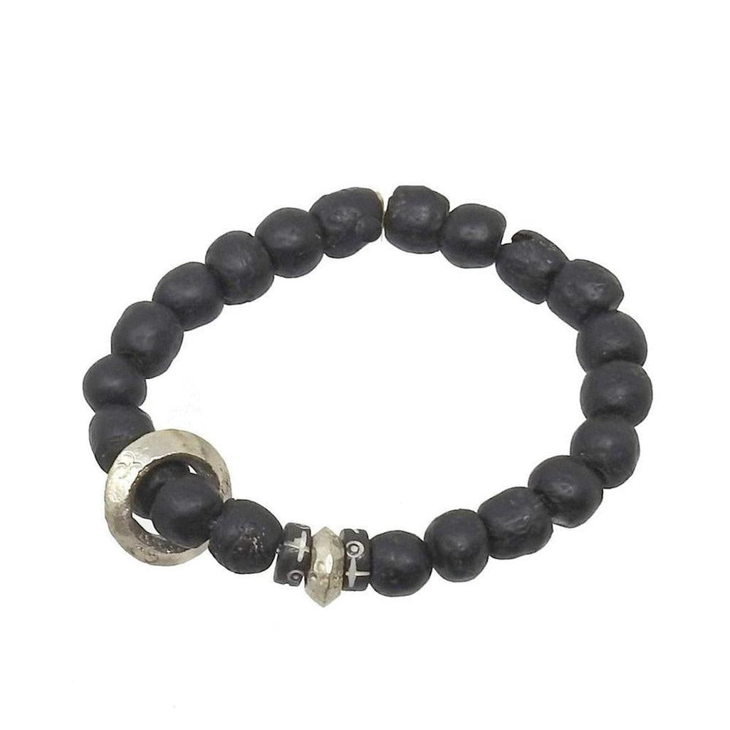 Black beaded meditation bracelet with silver accents for mindful moments.
