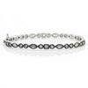 Silver mixed shape bangle featuring marquise, round, and square-cut cubic zirconia stones.
