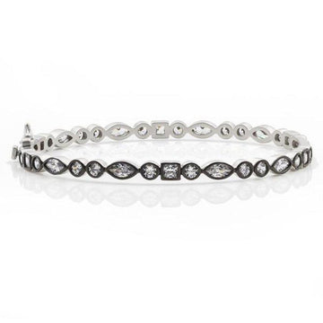 Silver mixed shape bangle featuring marquise, round, and square-cut cubic zirconia stones.
