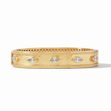 Gold hinged bangle bracelet with clear marquise-cut stones.
