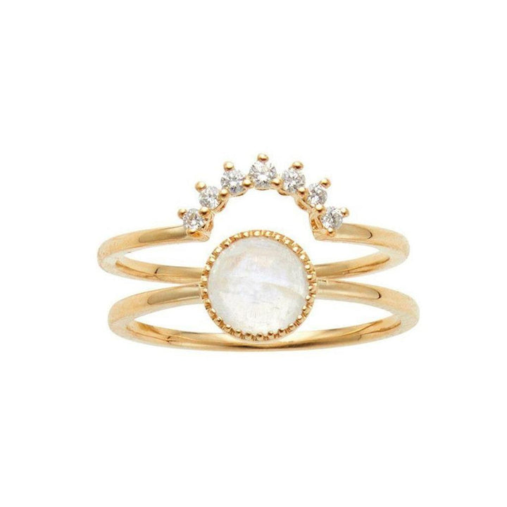 Gold double-band ring featuring a moonstone and diamond accents.
