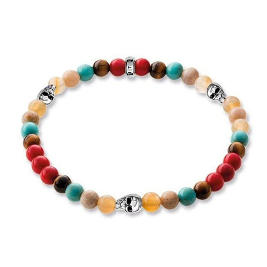 Multi-color beaded bracelet with skull accents.
