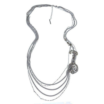 Multi-strand silver necklace with a long, ornate pendant featuring a cabochon stone.
