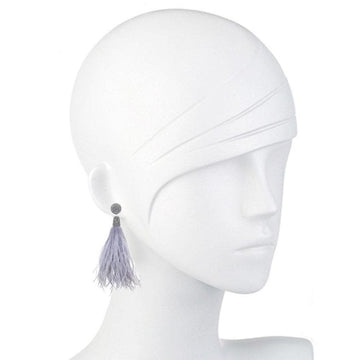 Lavender feather earrings with beaded accents, displayed on a mannequin.
