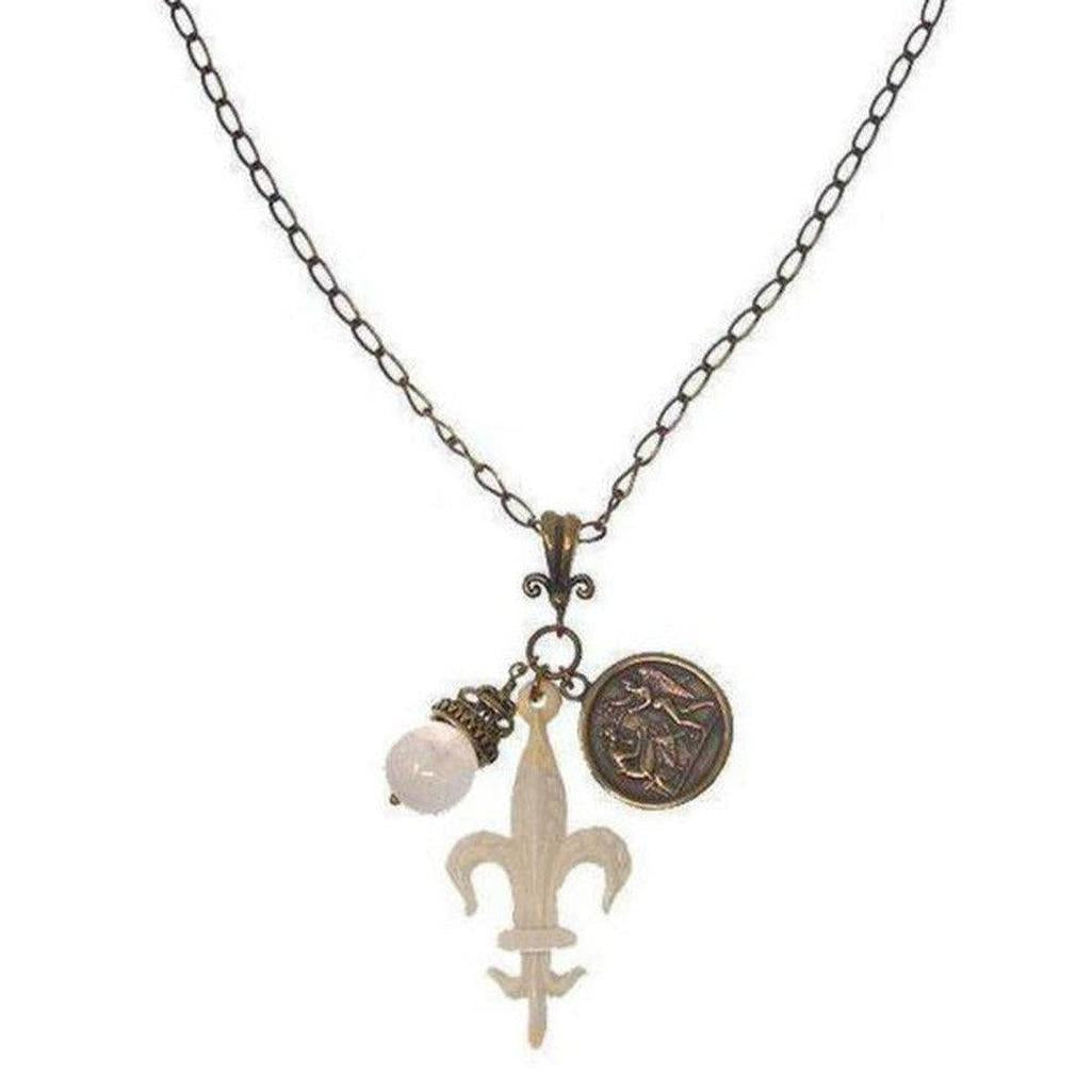 Fleur de Lis charm necklace with bronze chain, white stone, and antique coin accents.
