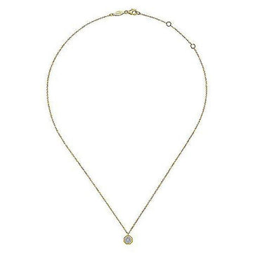 Dainty gold chain necklace featuring a small octagonal diamond pendant.
