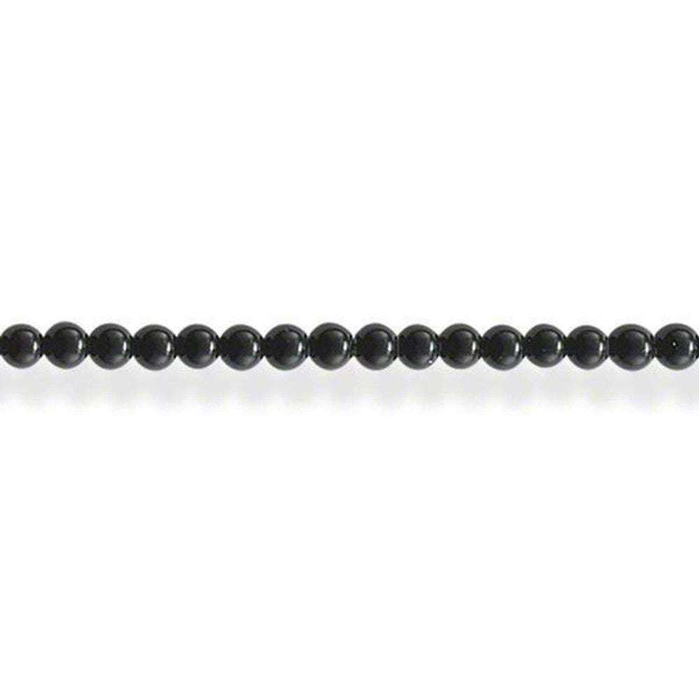 Sleek black onyx bead necklace on white background
