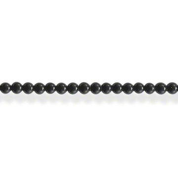 Sleek black onyx bead necklace on white background
