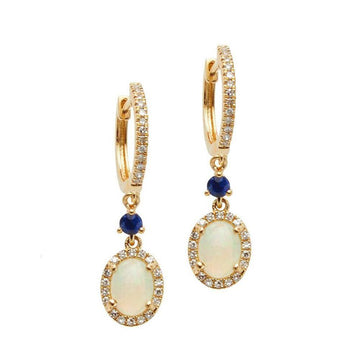 Opal Huggie Earrings with Blue Sapphires: 14k gold huggie hoops, oval opal & sapphire accents.
