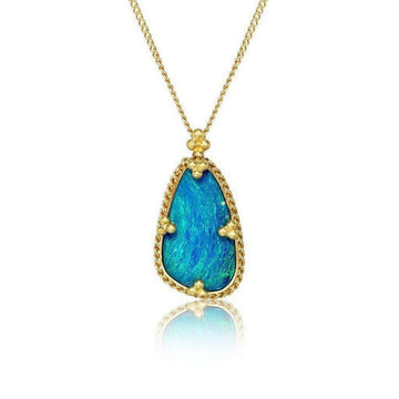 Teardrop opal pendant, gold setting, on white background

