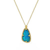 Teardrop opal pendant necklace with gold chain and ornate setting.

