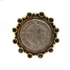 Original San Benito Grande ring: gold-tone setting, black stones, antique silver medallion.
