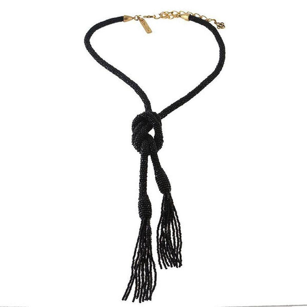 Oscar de la Renta black long beaded tassel necklace with knotted detail.
