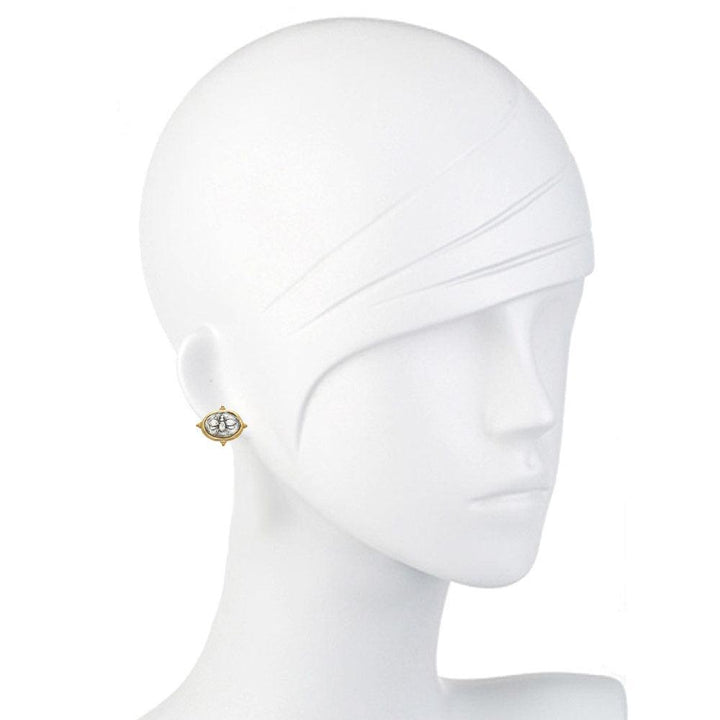Gold oval earrings featuring an engraved bee design, shown on a mannequin.

