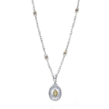 Oval diamond pendant necklace with ornate silver chain and accents.
