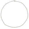 Oxidized silver necklace with 18k gold accents and blue topaz gemstones.
