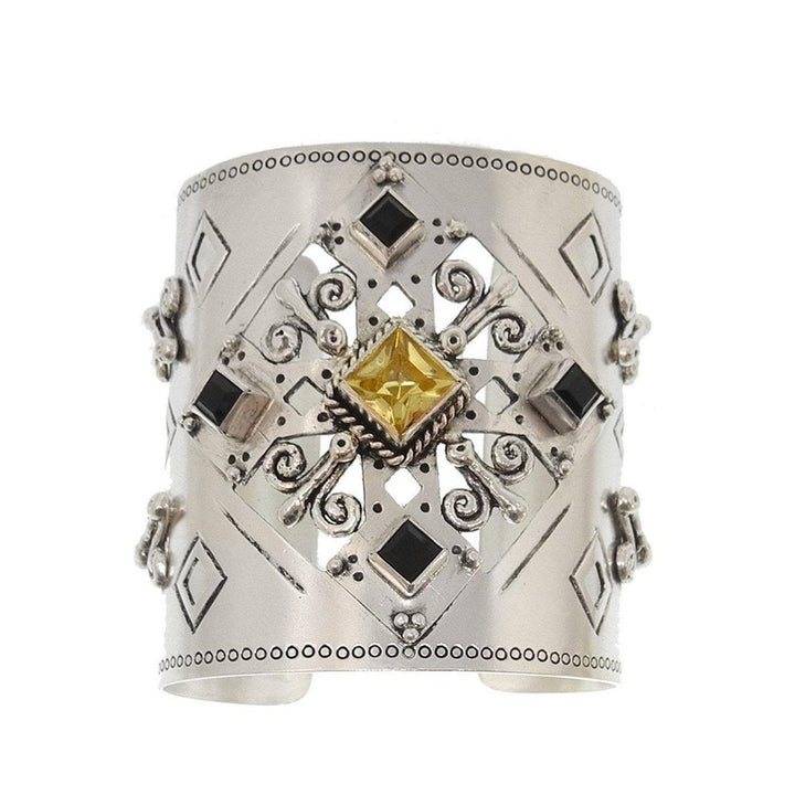 Silver Paloma Cross Cuff bracelet with yellow and black gemstones
