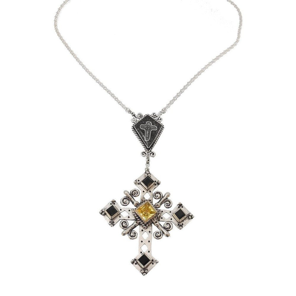 Silver cross necklace with black and yellow gemstones, intricate detailing.
